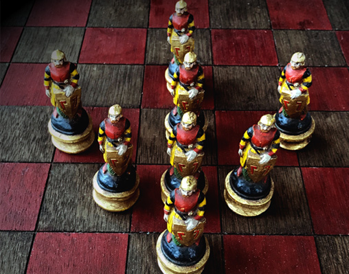 chess pieces forming an arrow